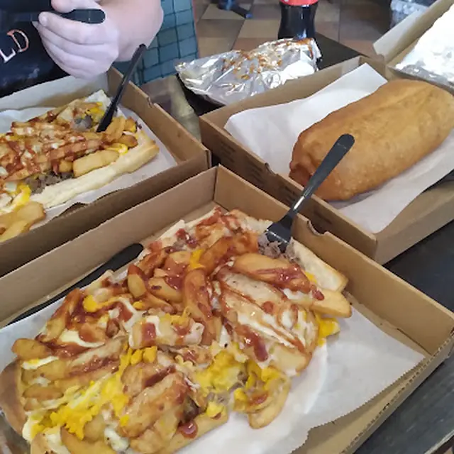Loaded fries in a takeout box