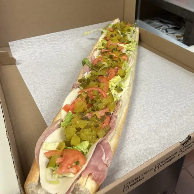 Large Italian sub loaded with cold cuts, lettuce and tomato