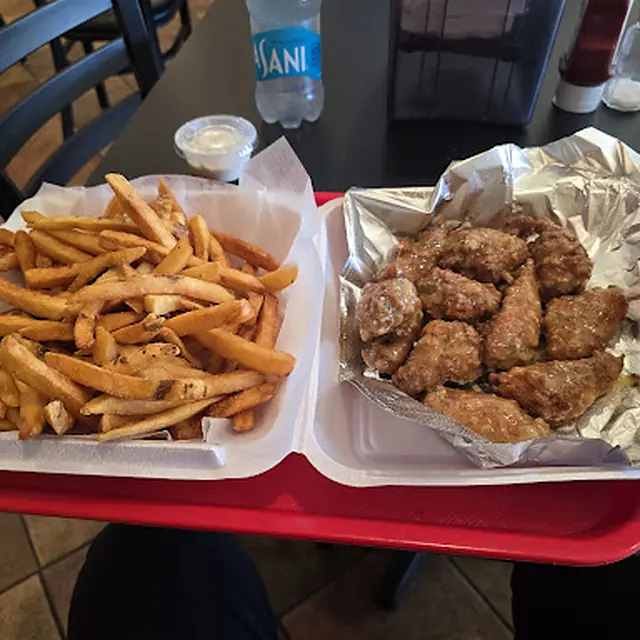 Chicken fingers and fries on a tray